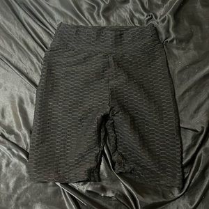 Black rubbed working out shorts.